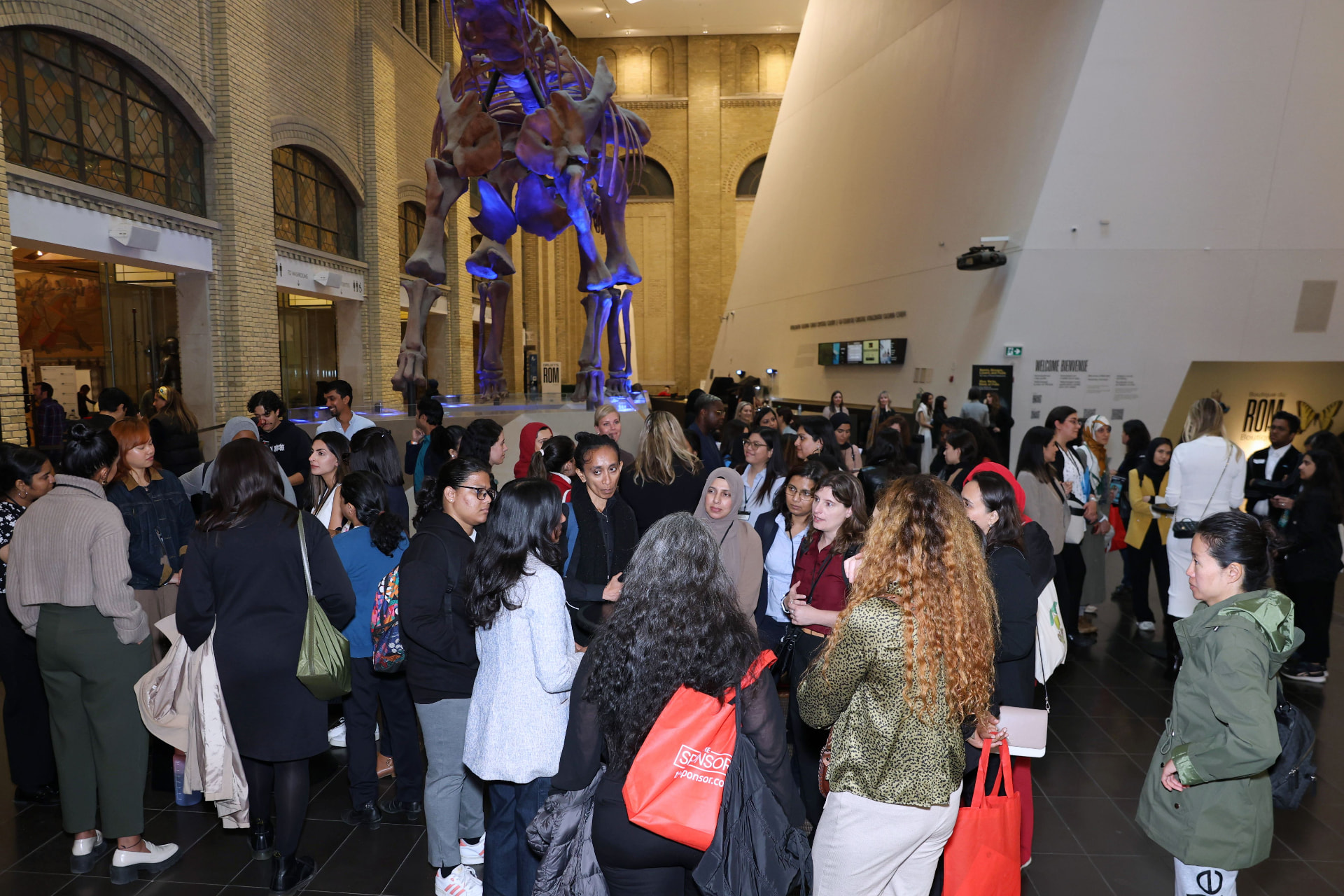 Women in tech networking by the dinosaurs